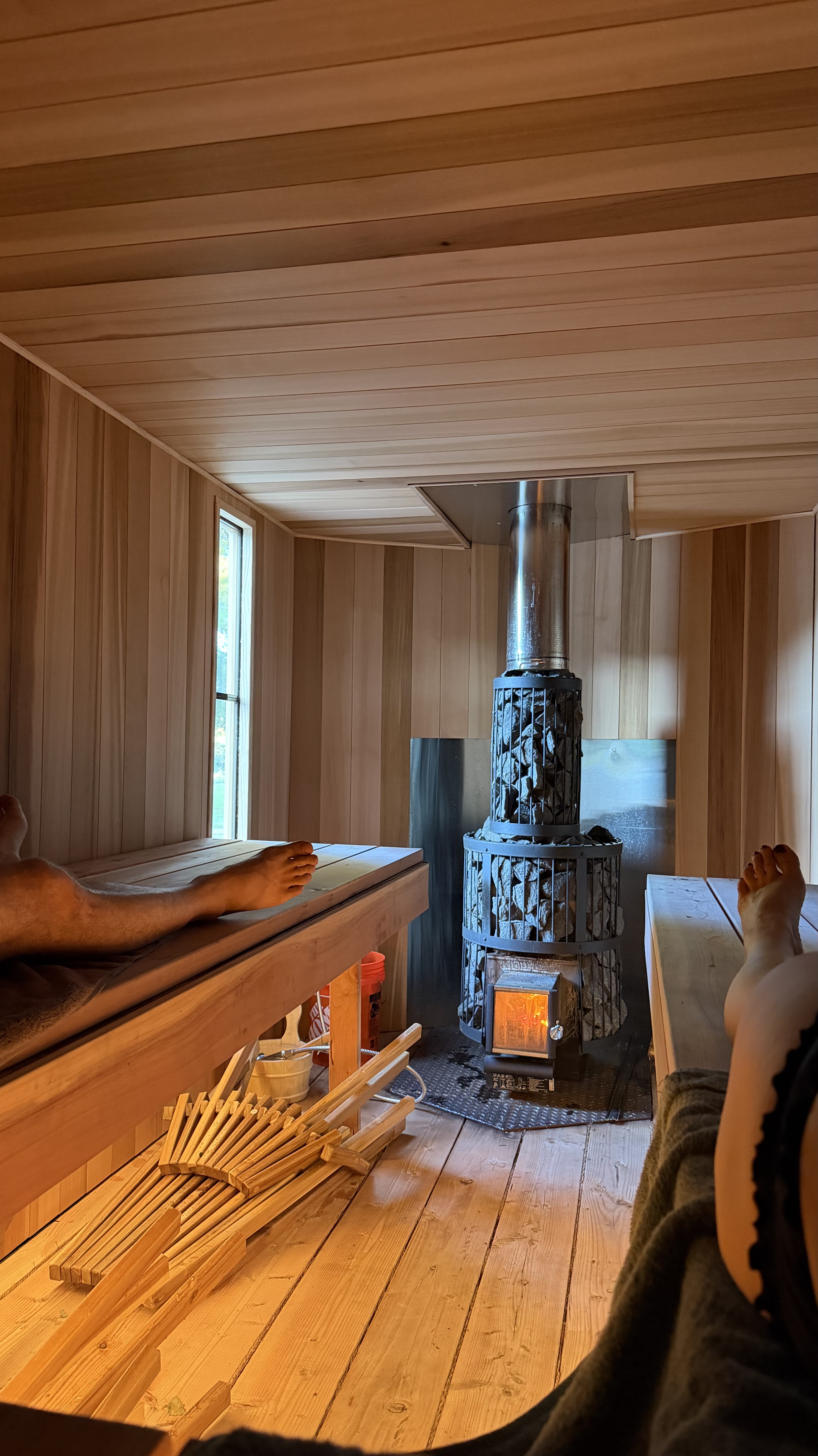 Guests relaxing inside the cedar sauna